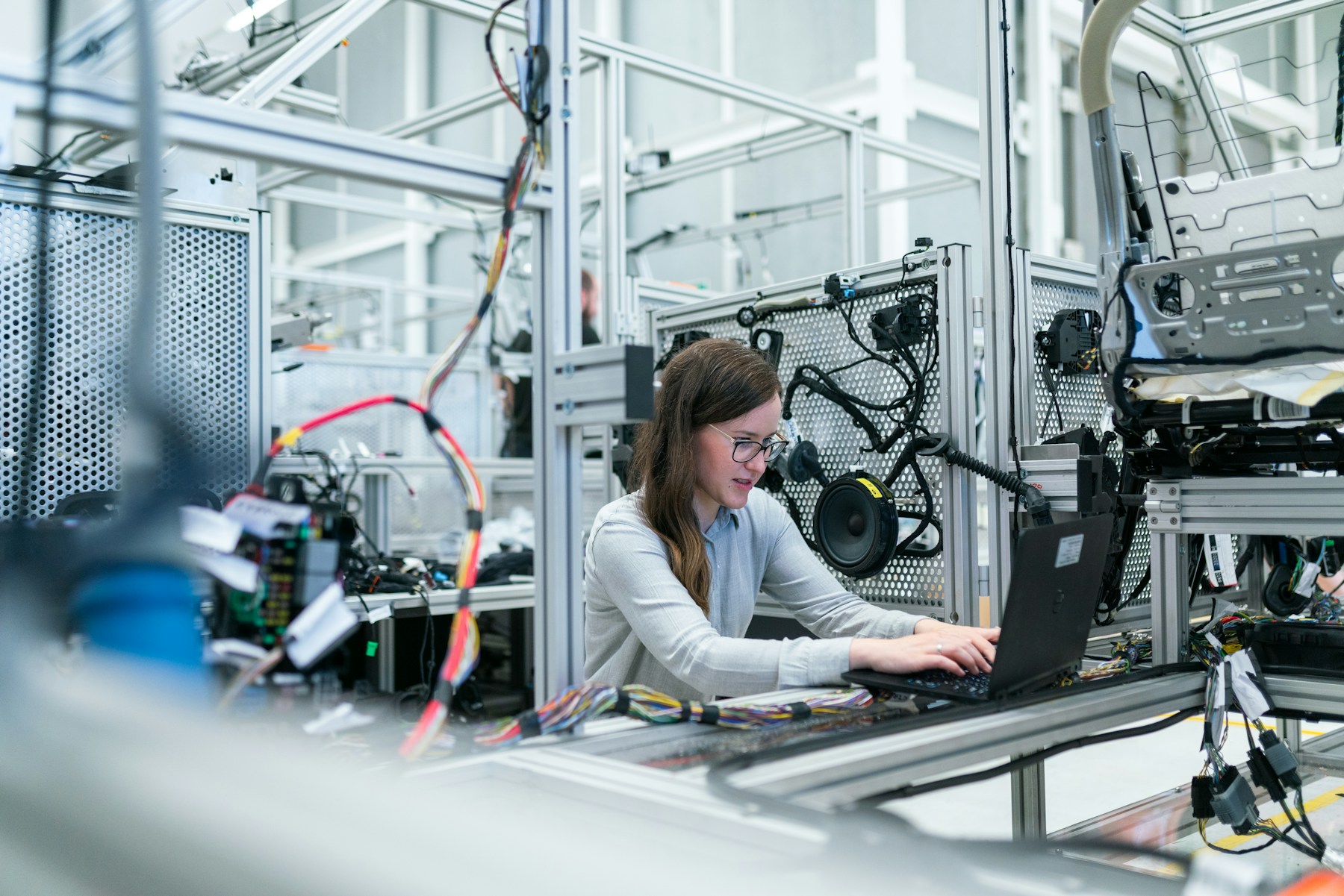 Engineer integrating instruments and automation in an advanced technical laboratory